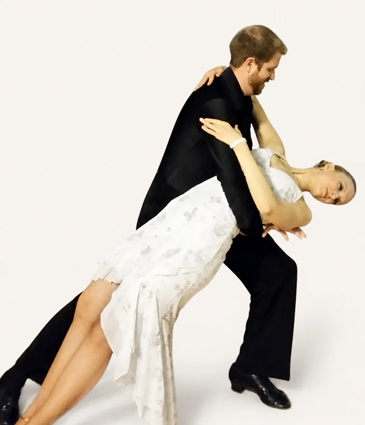 Eric Bird leading Bria Bird through a supported dance dip